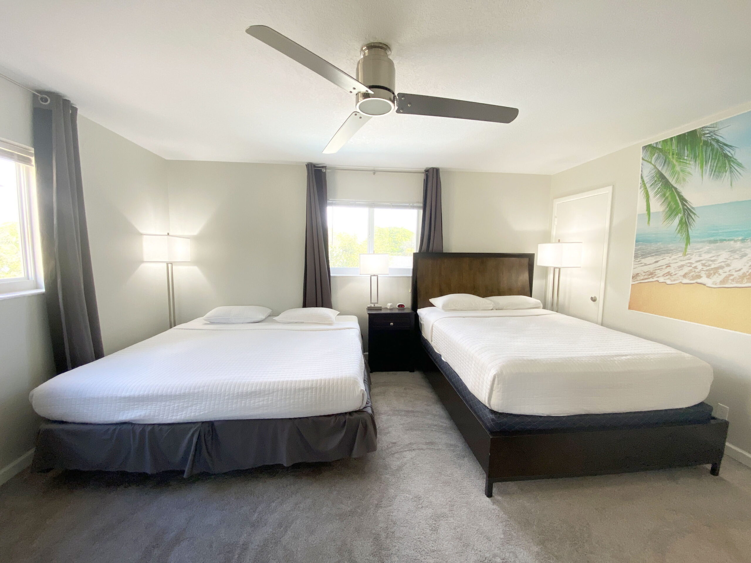 Master bedroom with two beds at Tarpon Harbor 1 vacation rental