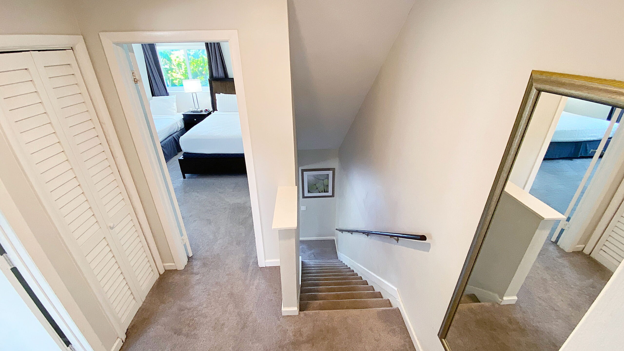 Interior stairway leading to the living area at Tarpon Harbor 1 vacation rental